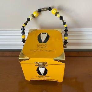 Collection of hand painted cigar box purses. Beautiful beaded handles.